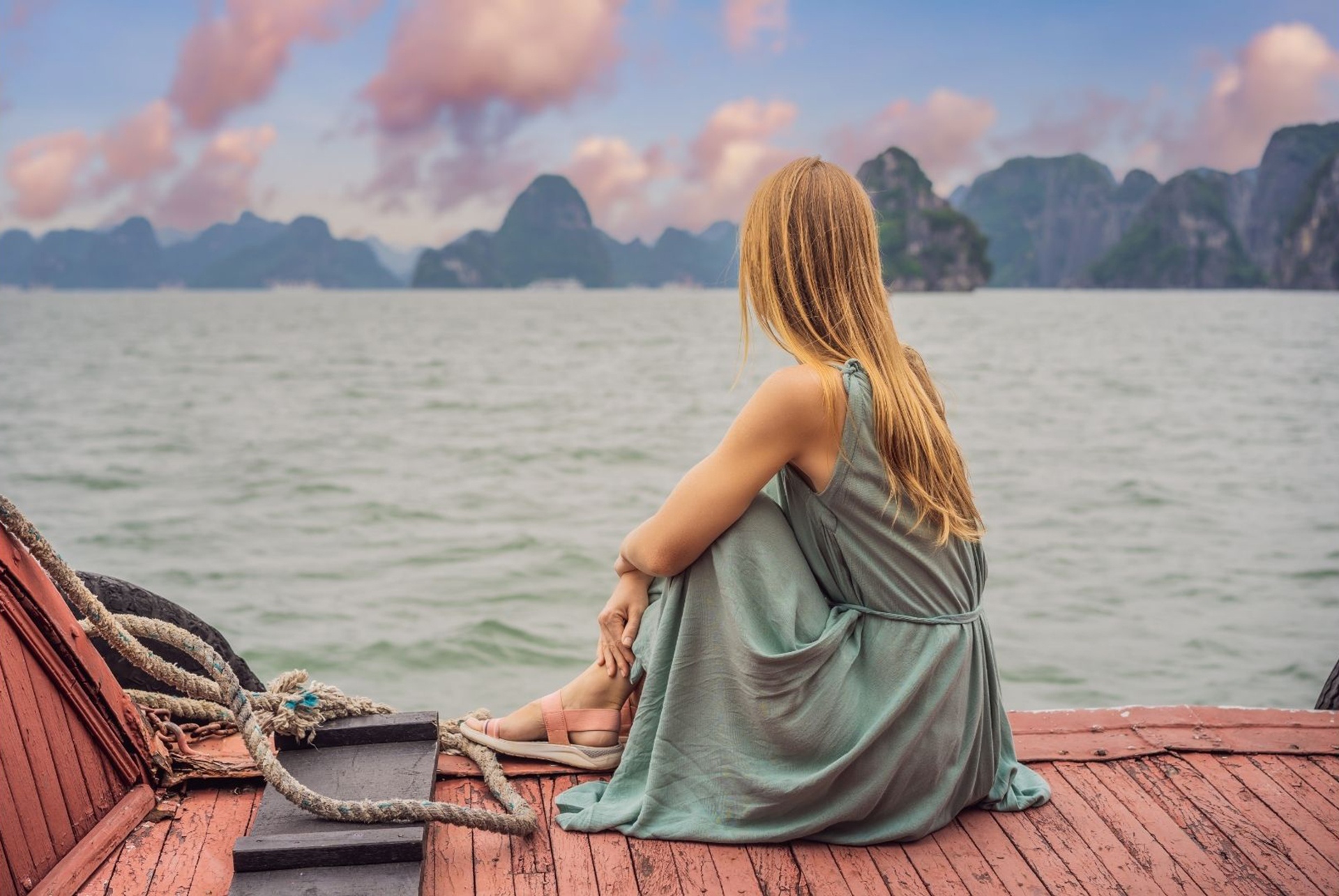 woman travelling by boat in Halong Bay